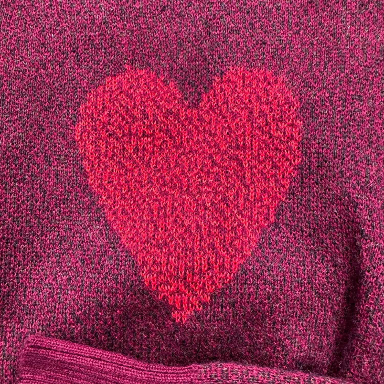 A knit red heart design.
