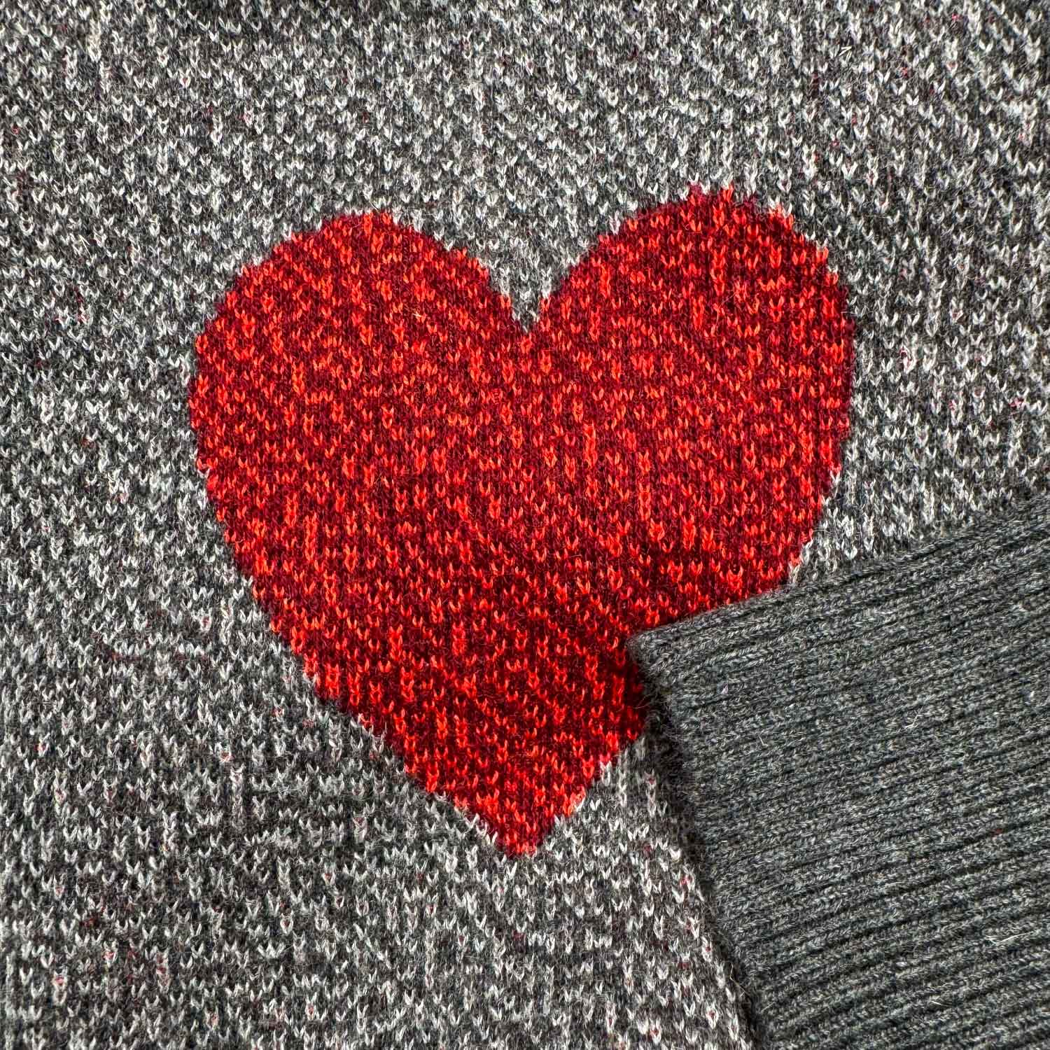 A knit red heart design.