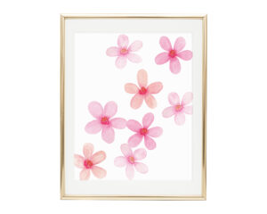 Photo of our Watercolor Cherry Blossom Art Print in a gold frame placed vertically.