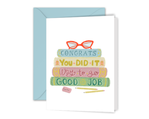 Our Stack of Books Congratulations Greeting Card with a light blue envelope. The card has an illustration of stacked books that say congrats, you did it, way to go and good job on them.
