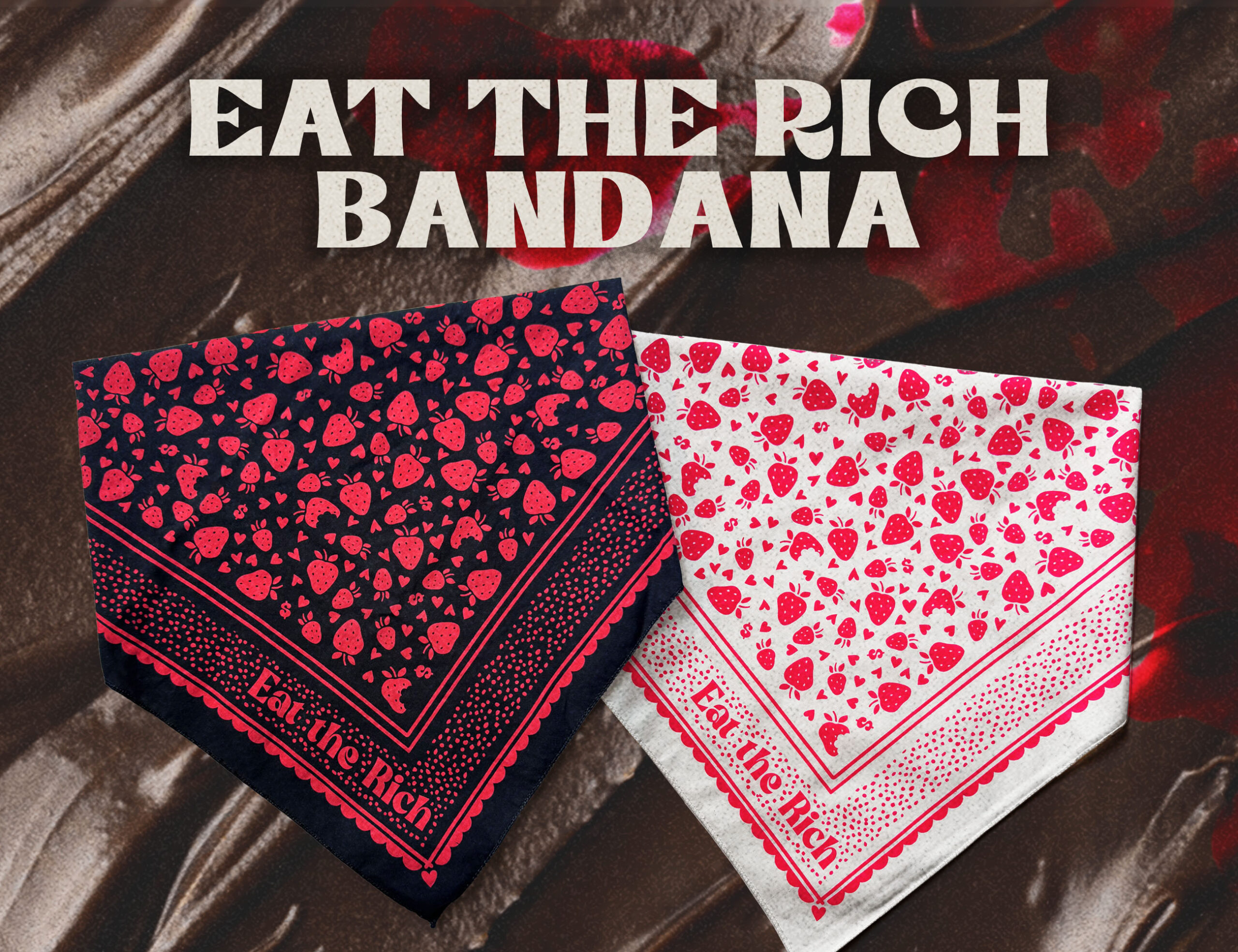 Black and cream “Eat the Rich” bandanas with red fruit-and-symbol print displayed over chocolate frosting and spattered red jam.