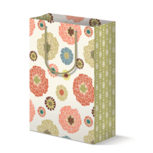 Gift bag with a colorful floral print on front/back and green dot print on the side panels