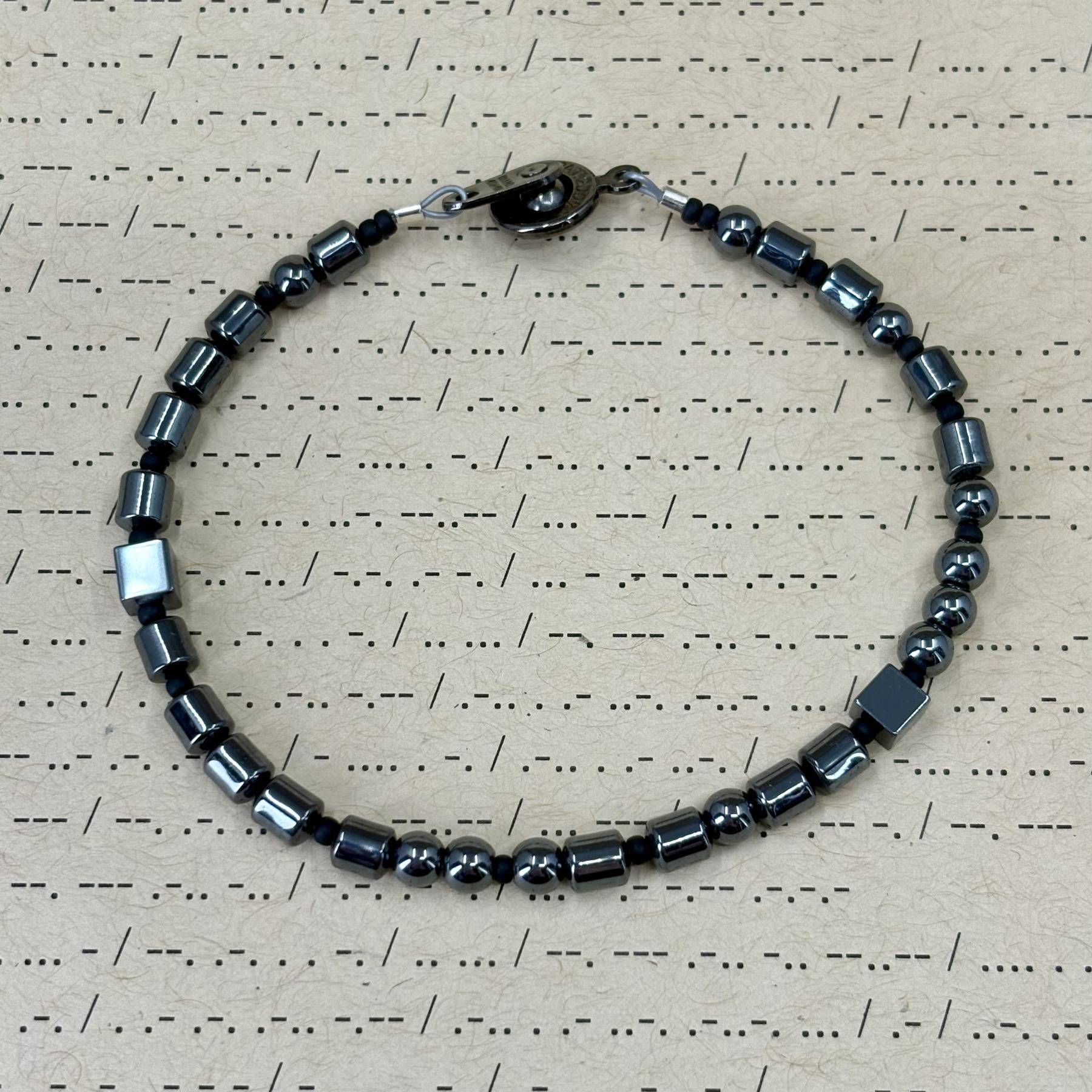 Not Today Satan Morse Code Bracelet made with hematite and small glass beads.