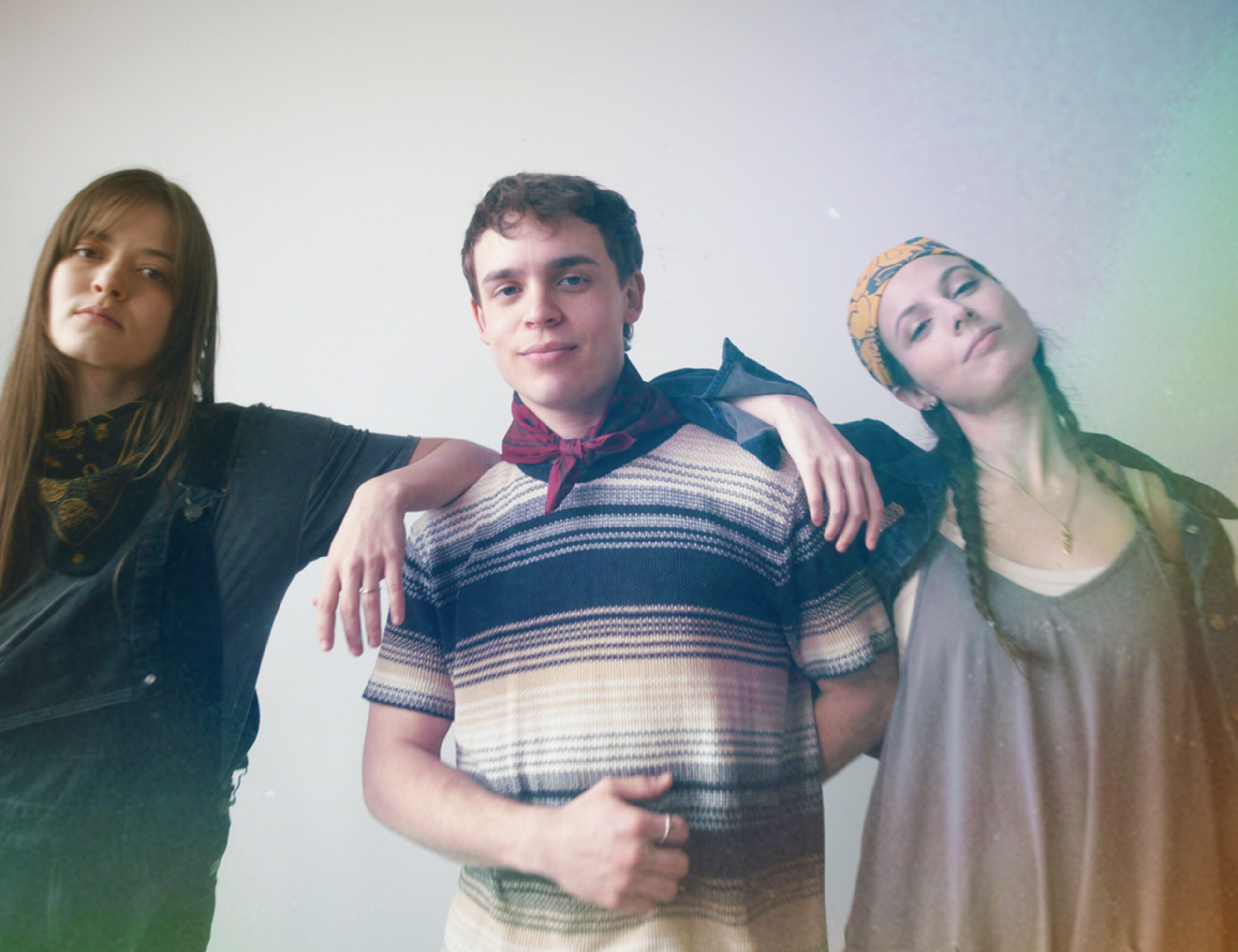 three young adults model resist persist dissent bandanas