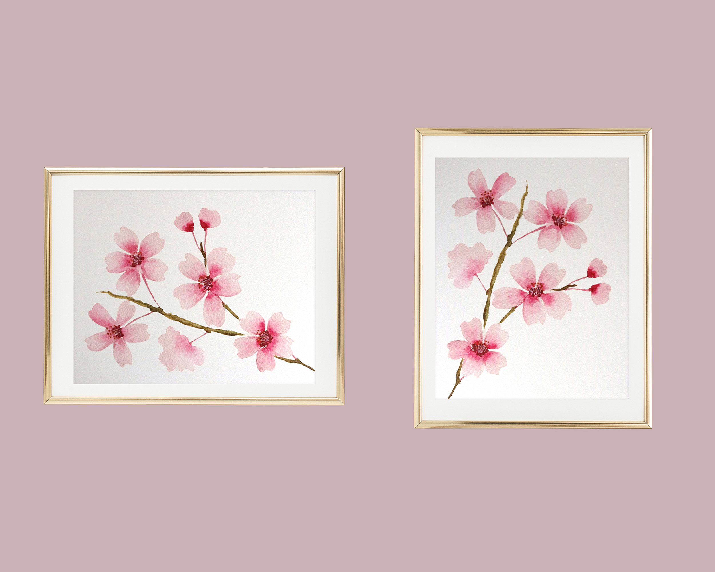 Photo of our Watercolor Cherry Blossom Branch Art Print in a gold frame both vertical and horizontal. The art print features a watercolor painting of a single branch of pink cherry blossoms.
