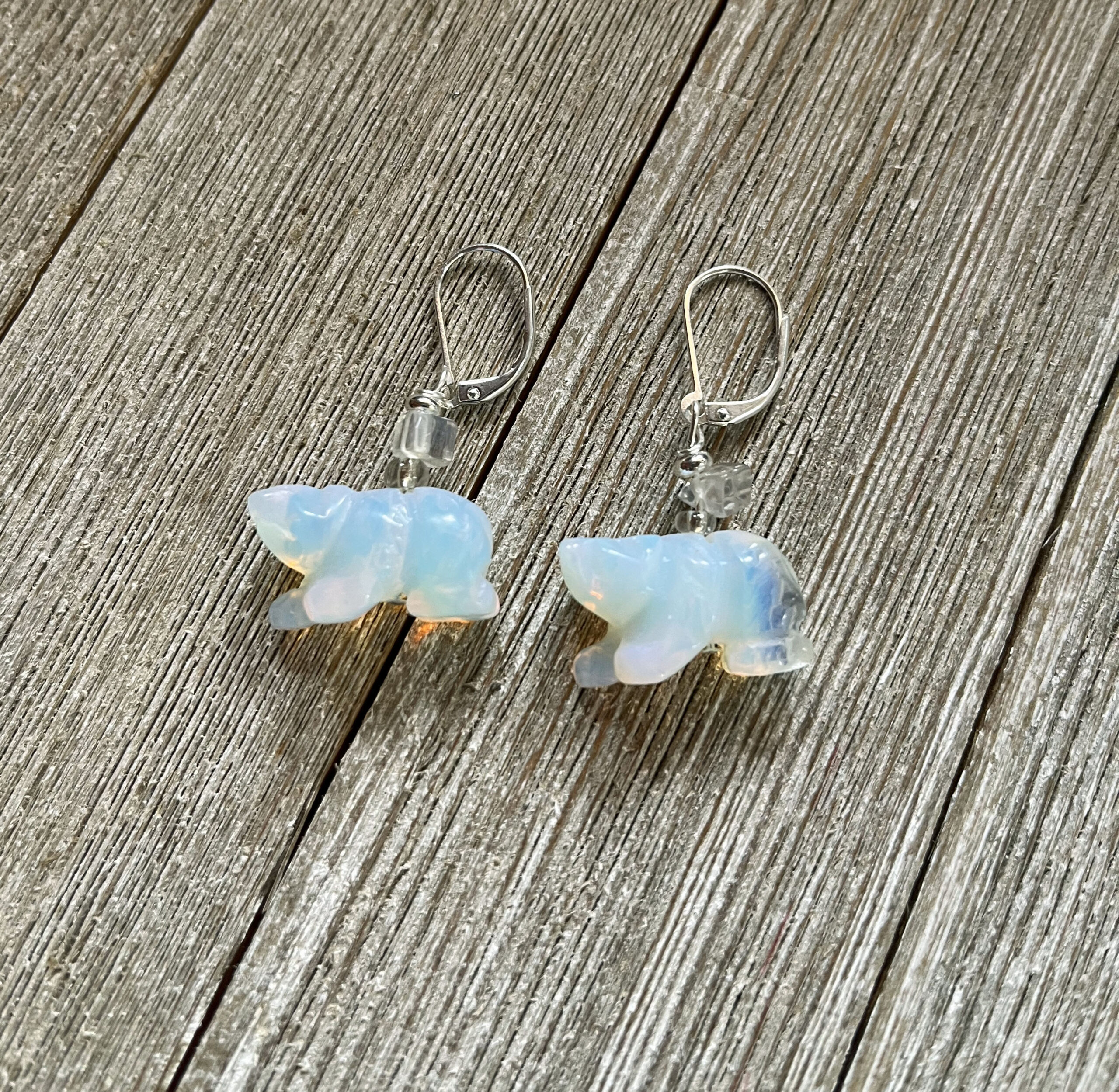 carved white bear earrings of opalite stone on lever back ear wires