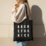 fuck ice tote bag in black with white lettering reads ABCDE FUCK ICE