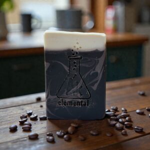 Brown soap surrounded by coffee beans